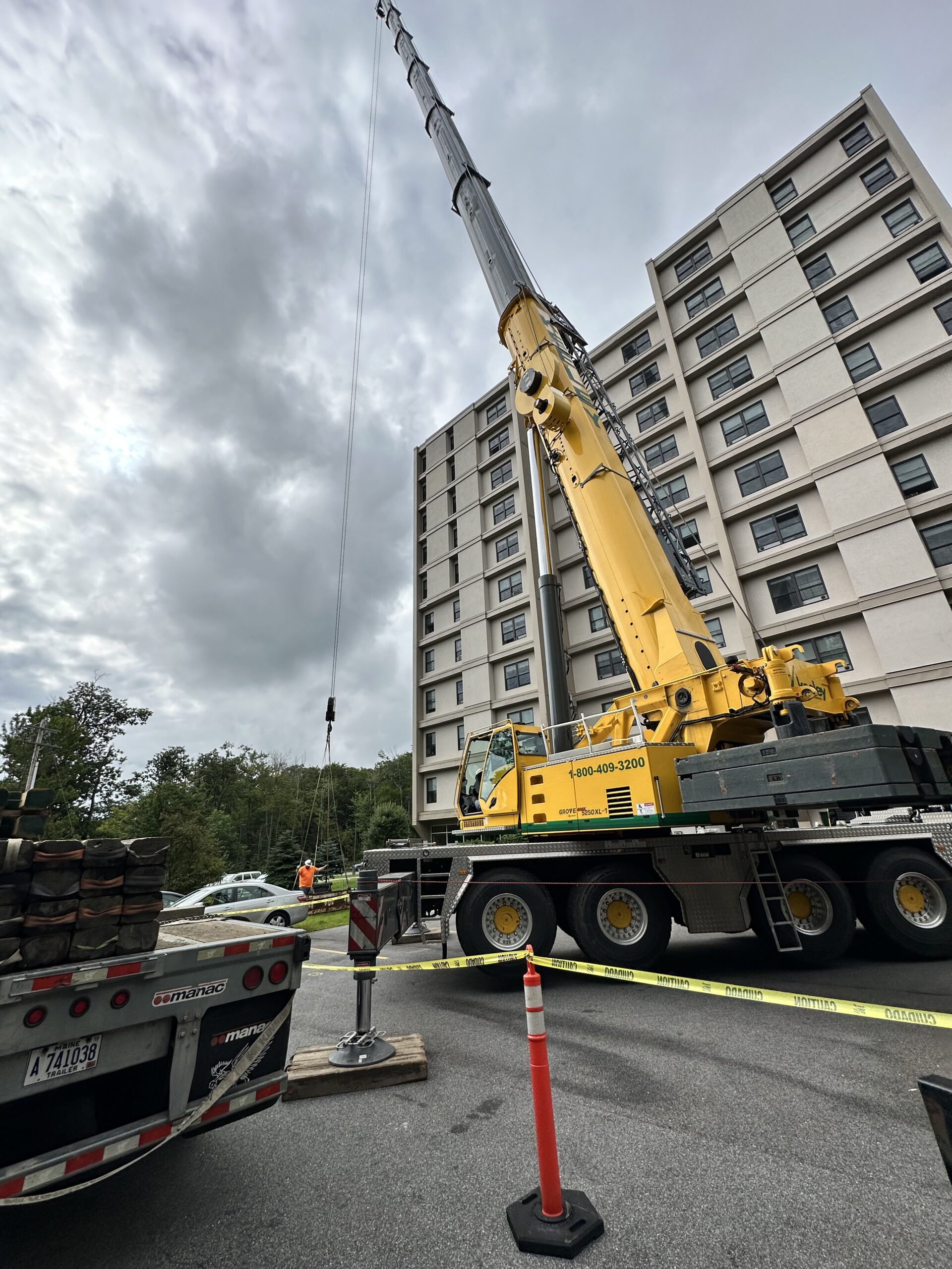 Yellow Grove mobile crane deployed at apartment building